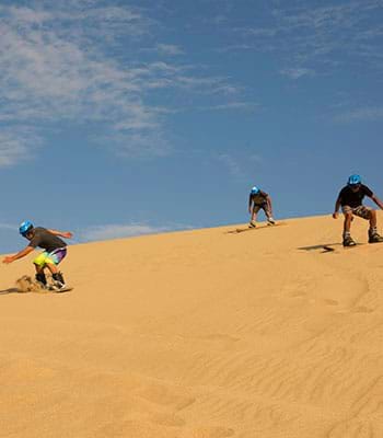Sandboarding in the dunes