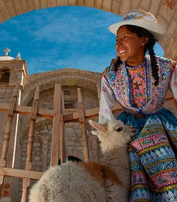Local girl with a baby llama