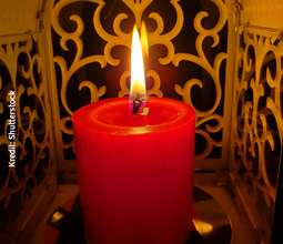 Red candle lit on May 1st for the anniversary of the Virgin of Chapi