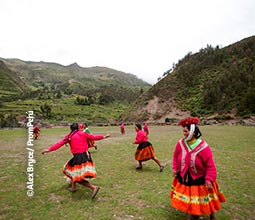 Women of the Huilloc Community playing soccer.