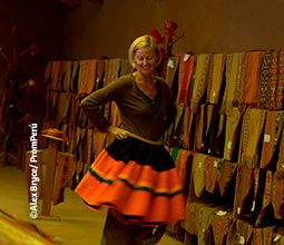 Tourist trying on a typical Huilloc skirt.
