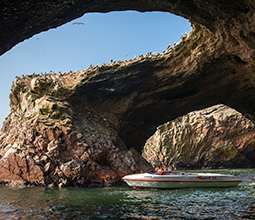 Yacht sailing through the Ballestas Islands