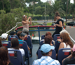 Tourists in a panoramic bus touring Lima
