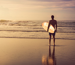Surfer on the sea shore of Lima