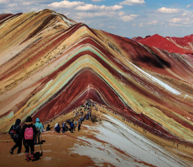Panoramic view of travelers at Vinicunca, the mountain of seven colors, Cusco.