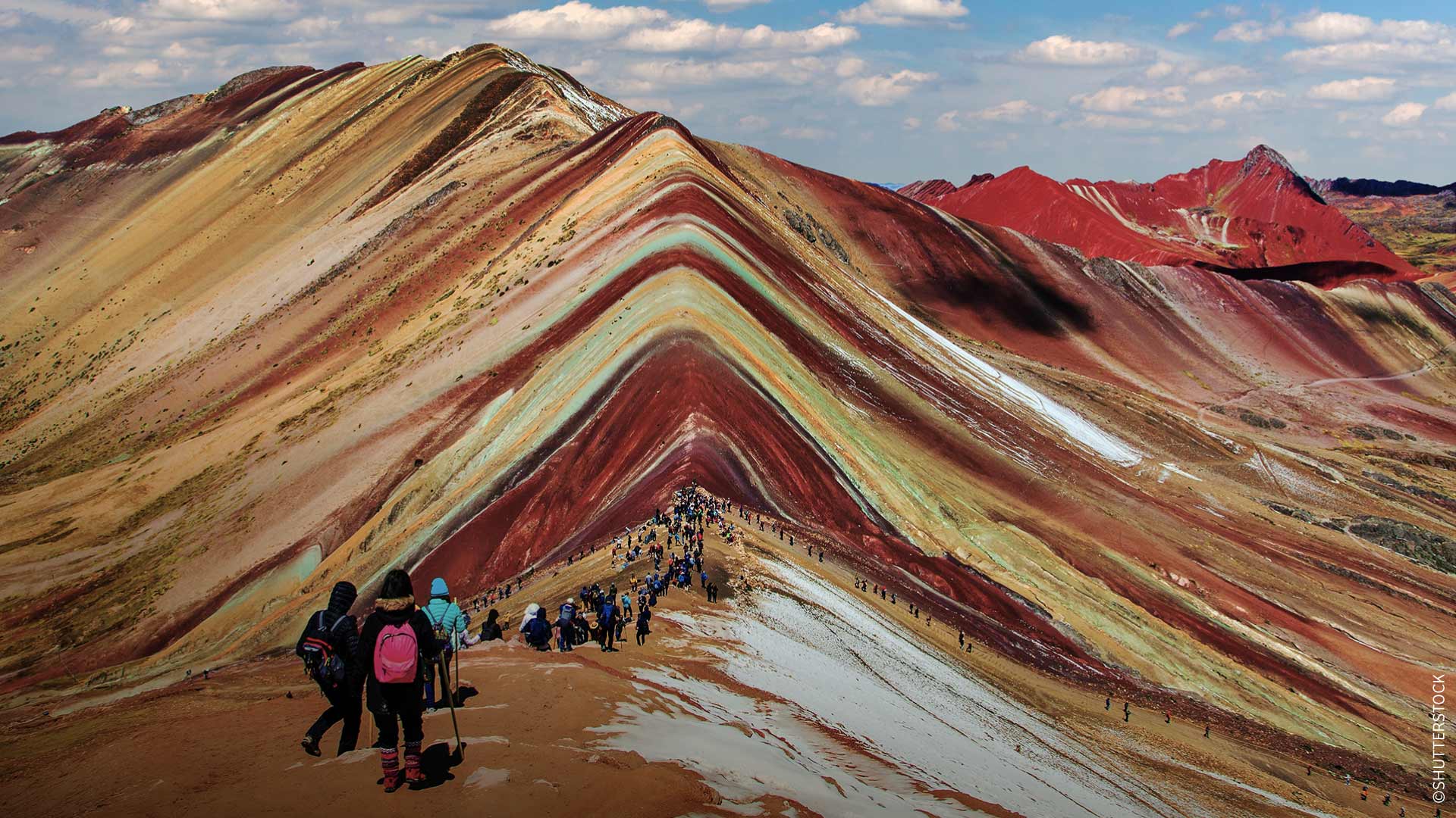 Panoramic view of travelers at Vinicunca, the mountain of seven colors, Cusco.